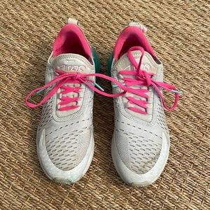 Pink and teal Nike tennis shoes. Worn and perfect condition